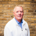 John Kellin with brick background